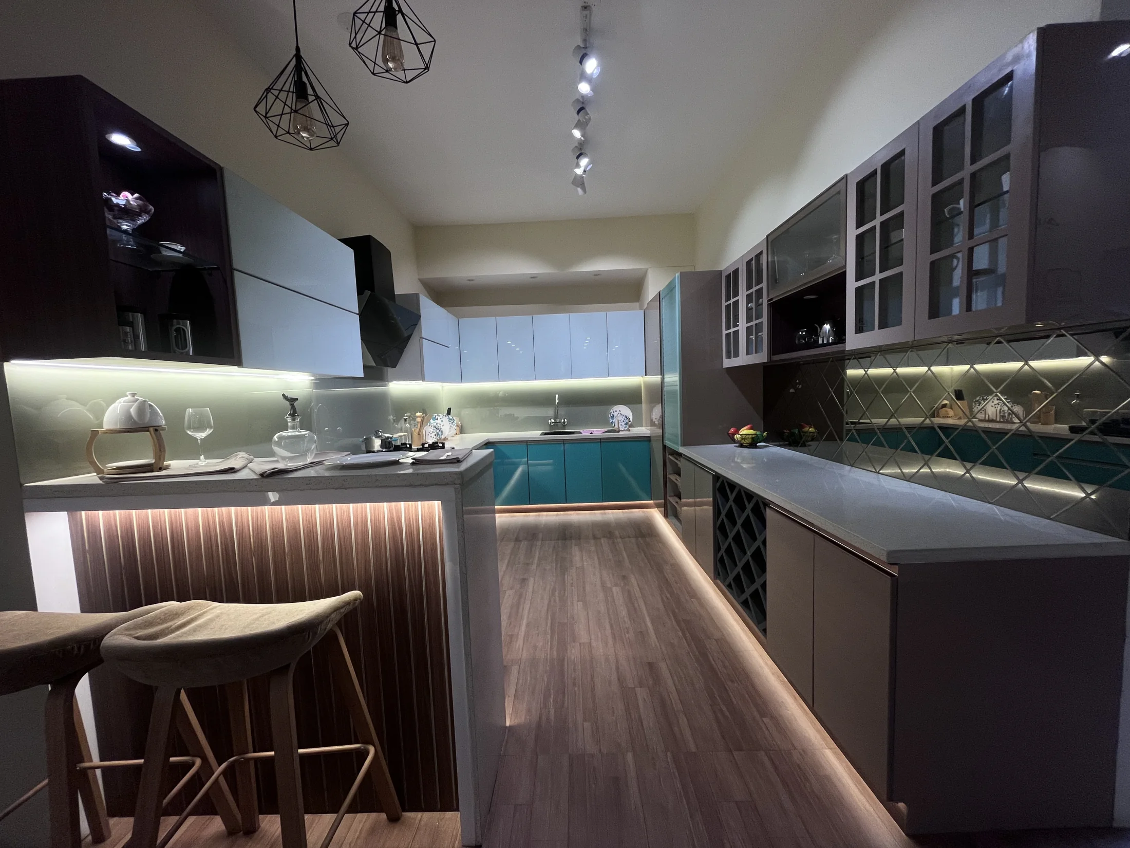 Kitchen island with surrounding cabinetry by SK Spaces